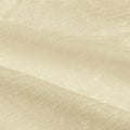Detailed close-up of light cream fabric with a subtle shimmering texture and elegant gentle folds