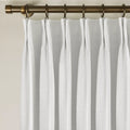 Snow White Liz Linen Pleated Curtains triple pinch pleat heading on a bronze curtain rod