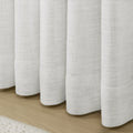 Snow White Liz Linen Pleated Curtains rounded curtain hems above a pale wood floor