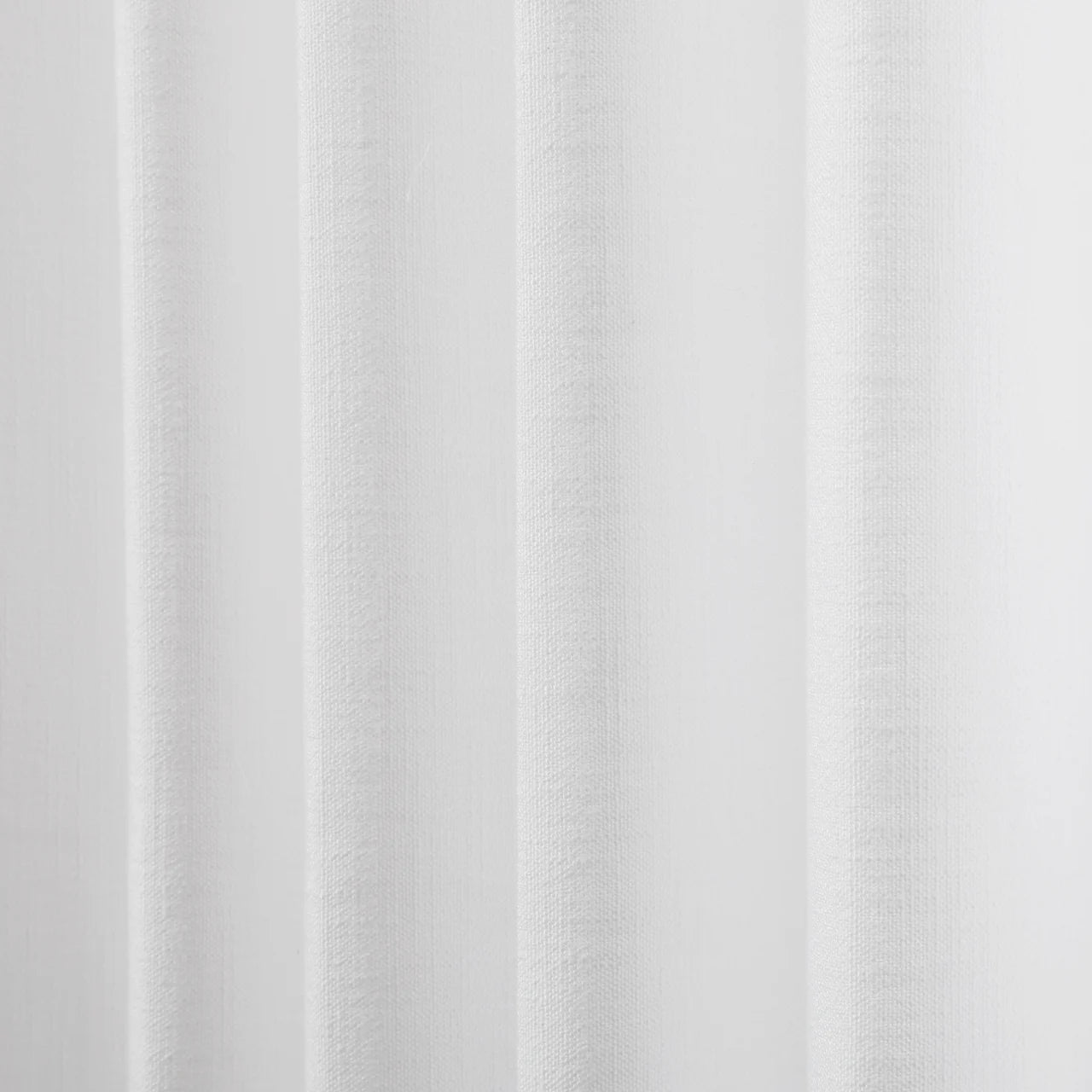 Snow White Liz Linen Pleated Curtains semi-sheer linen weave softly backlit by daylight