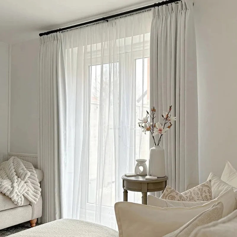 Snow White Liz Linen Pleated Curtains softly filtering daylight in a white reading nook