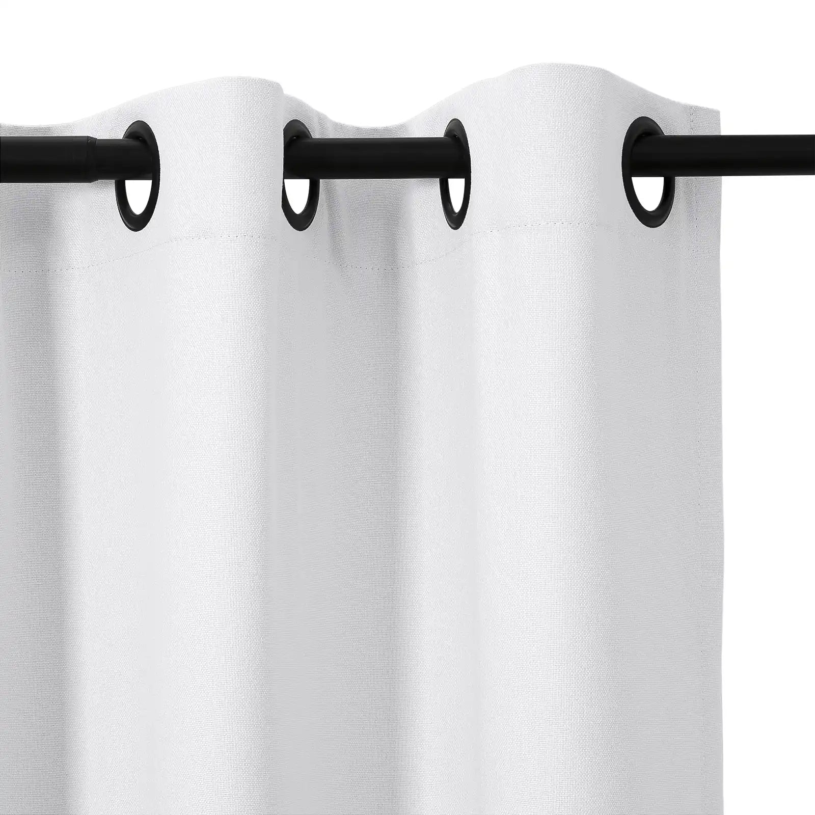 Close-up of a white textured fabric curtain with black metal grommets evenly spaced along the top edge, hanging from a black curtain rod