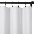 A white textured curtain panel hung by black clip rings on a black metal rod displaying subtle vertical folds