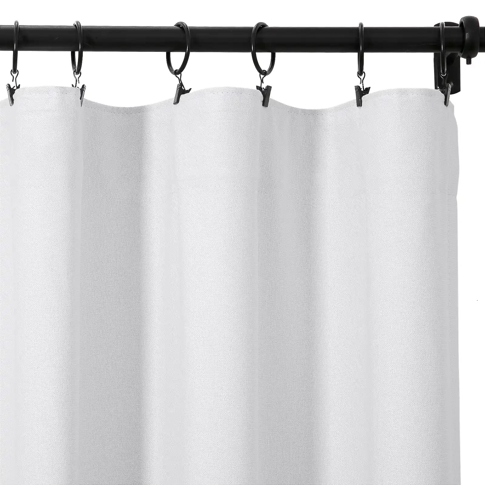 A white textured curtain panel hung by black clip rings on a black metal rod displaying subtle vertical folds