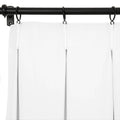 White pinch pleat curtains with a crisp design suspended by white plastic hooks from a matte black curtain rod and rings