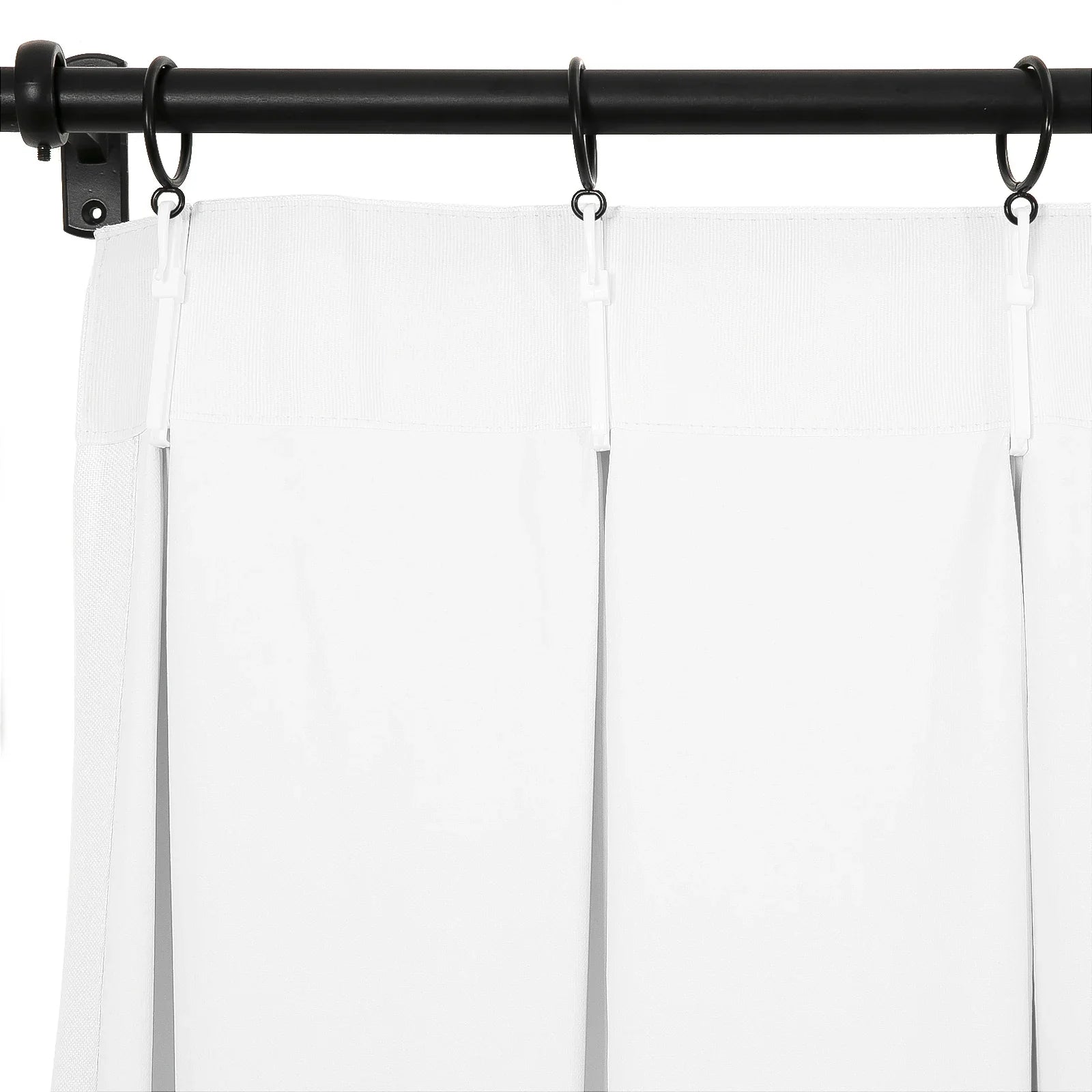 White pinch pleat curtains with a crisp design suspended by white plastic hooks from a matte black curtain rod and rings