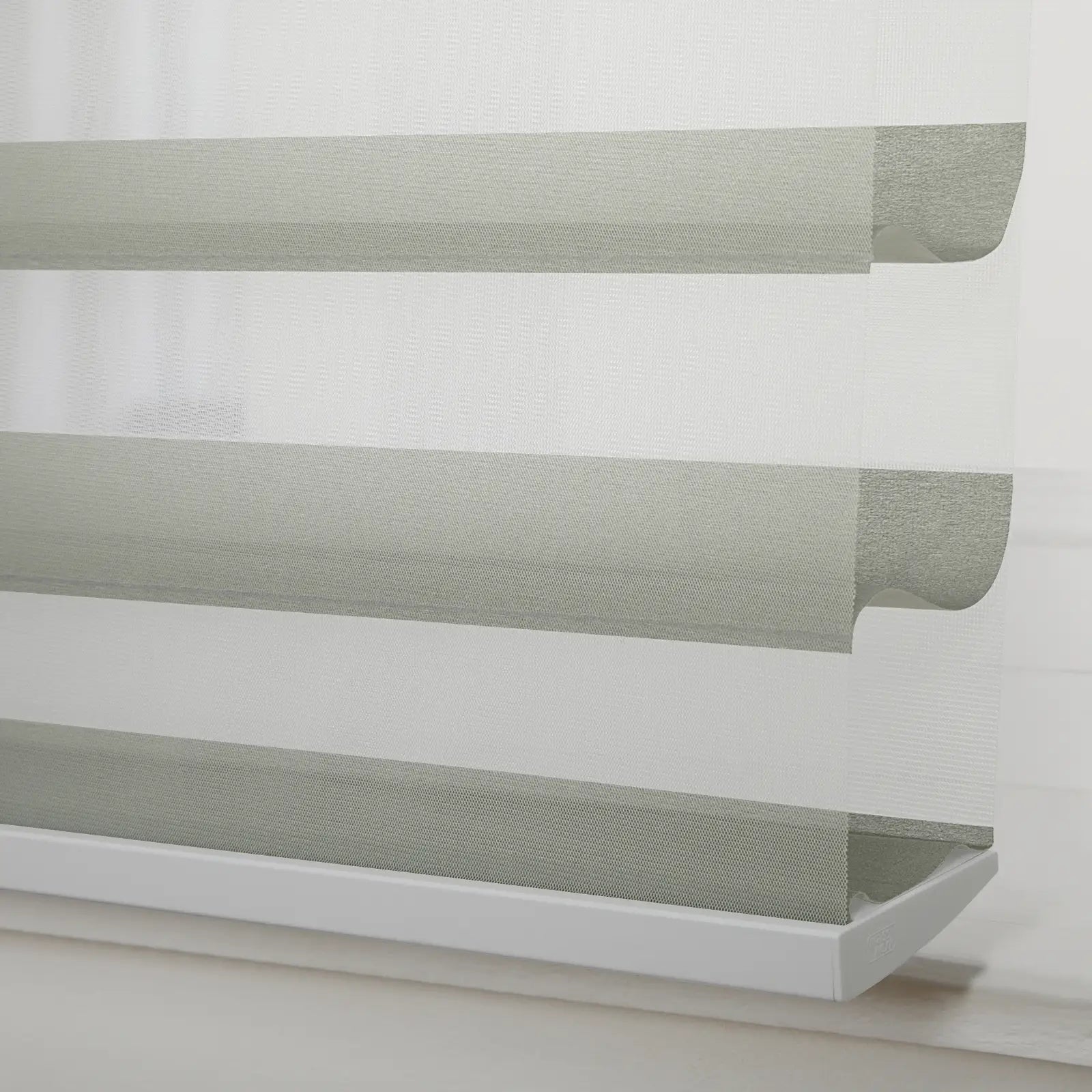 Textured light grey and white zebra Blind with alternating opaque and sheer horizontal stripes installed in a window