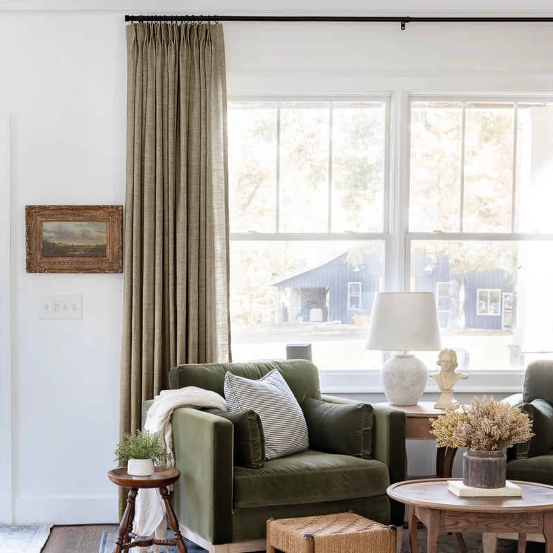 Taupe Grey Liz Linen Pleated Curtains beside a green sofa and dried-flower coffee-table arrangement