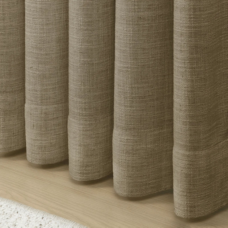 Taupe Grey Liz Linen Pleated Curtains rounded curtain hems above a pale wood floor