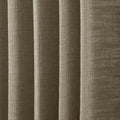 Close-up of a warm taupe textured fabric showing distinct vertical folds and a visible slub weave