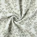 Textile featuring a white woven background with a repeating pattern of slender grey stylized leaves and branches, showing soft ripples and a central spiral fold highlighting its texture