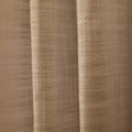 A light beige textured woven fabric curtain with prominent vertical folds and a distinct grid-like weave