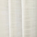 Photograph of a cream-colored sheer woven fabric showing a subtle grid texture and gentle vertical drapes