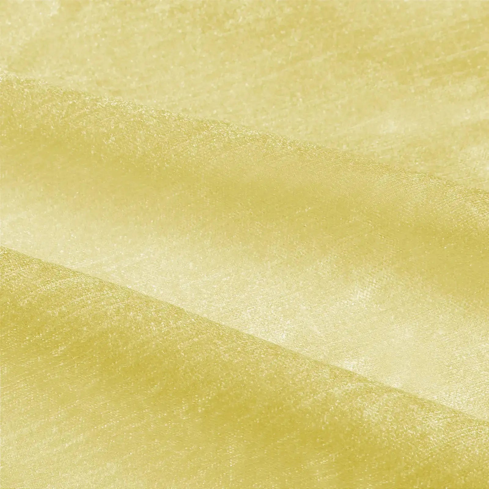Photograph of a light yellow fabric with a subtle sheen, fine crinkled texture, and soft diagonal folds