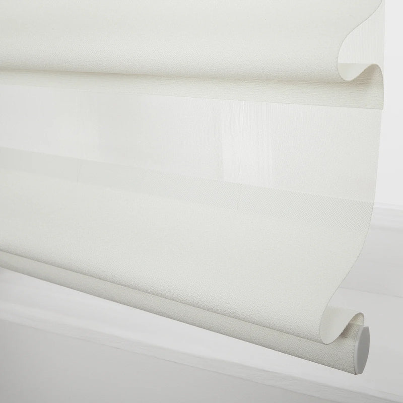White layered roller Blind with alternating sheer and opaque textured fabric partially unrolled showing the bottom bar and end cap